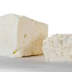 Close-up images of  feta cheese on cutting board